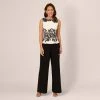 Adrianna Papell Sleeveless Peplum Jumpsuit With Scroll Lace Details In Ivory Black