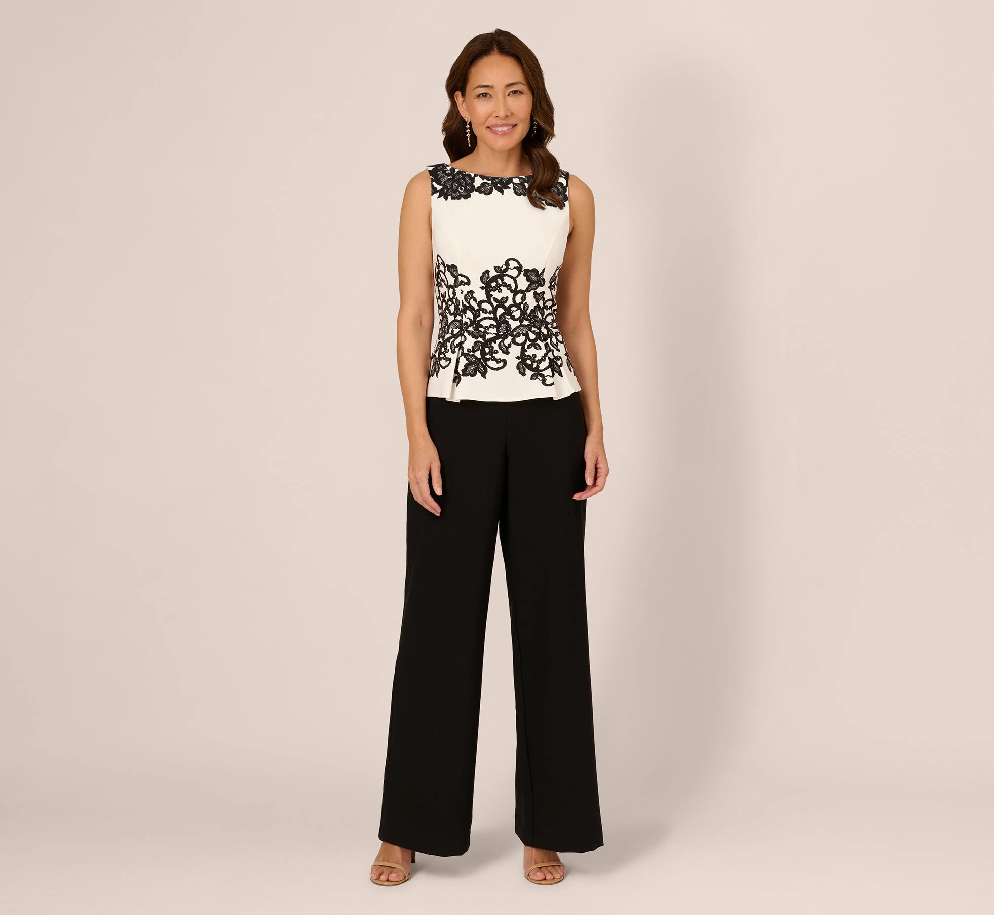 Adrianna Papell Sleeveless Peplum Jumpsuit With Scroll Lace Details In Ivory Black 1 Adrianna Papell Sleeveless Peplum Jumpsuit With Scroll Lace Details In Ivory Black