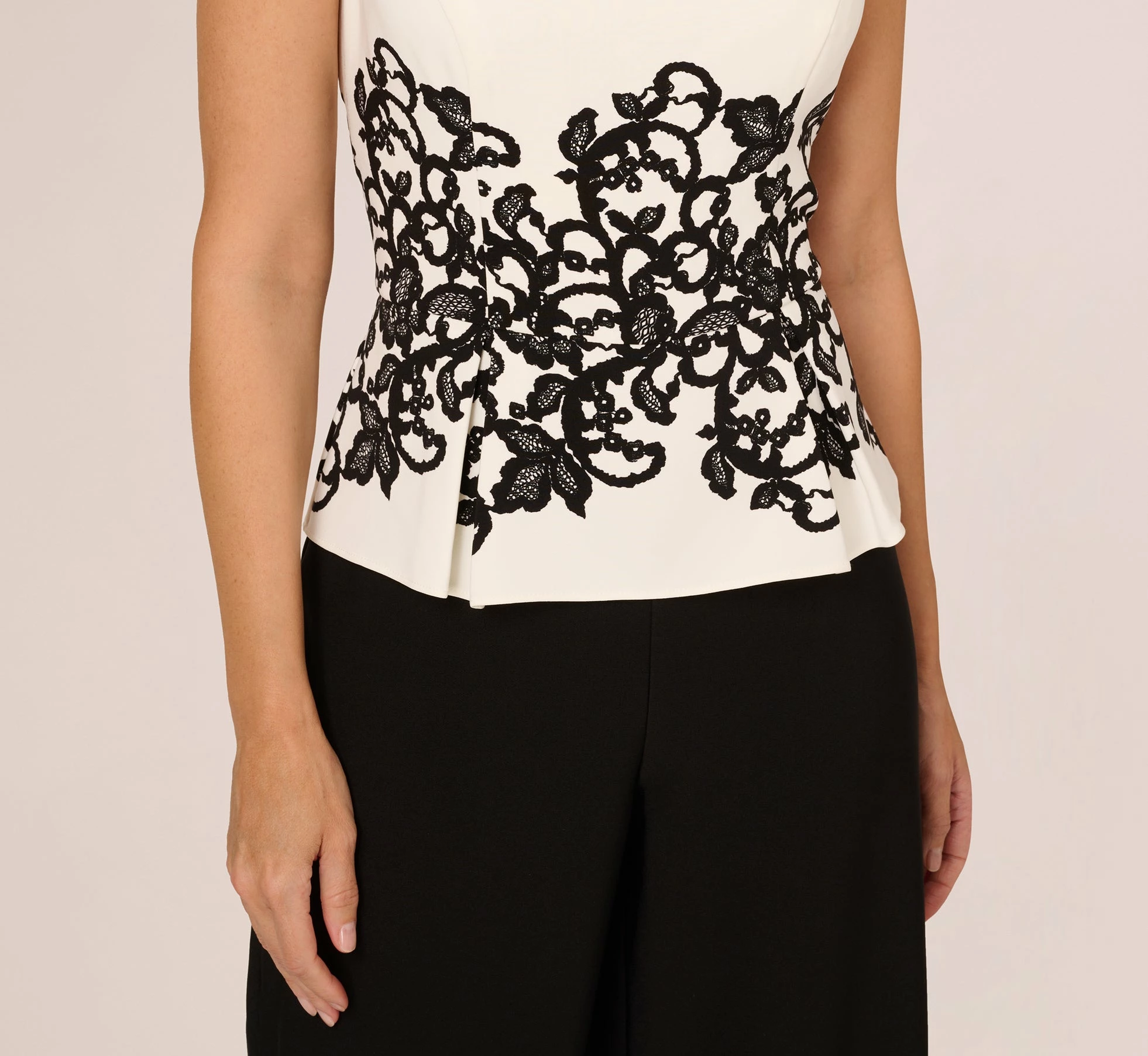 Adrianna Papell Sleeveless Peplum Jumpsuit With Scroll Lace Details In Ivory Black 3 Adrianna Papell Sleeveless Peplum Jumpsuit With Scroll Lace Details In Ivory Black - Image 3