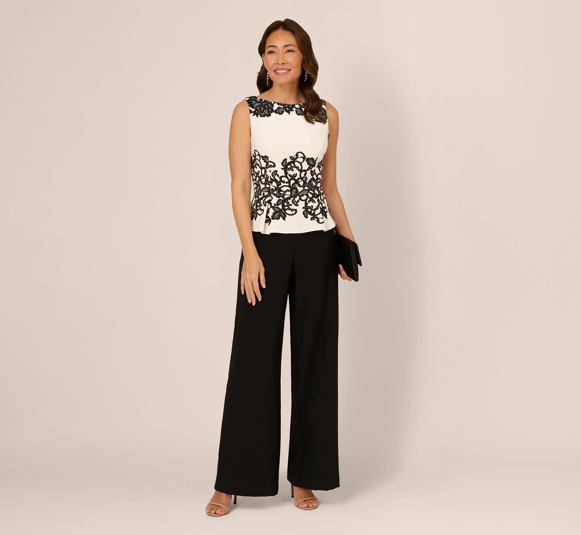 Adrianna Papell Sleeveless Peplum Jumpsuit With Scroll Lace Details In Ivory Black 2 Adrianna Papell Sleeveless Peplum Jumpsuit With Scroll Lace Details In Ivory Black - Image 2