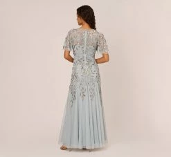 Adrianna Papell Long Floral Beaded Gown With Flutter Sleeves In Blue Heather 9 Adrianna Papell Long Floral Beaded Gown With Flutter Sleeves In Blue Heather -Adrianna Papell Shop AP1E208445 AA469 Regular Back c9d0d51f e45d 40de 9768 104ae7b9a220